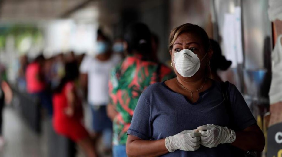 Women queue patiently outside a supermarket during COVID-19 Lockdown in Panama